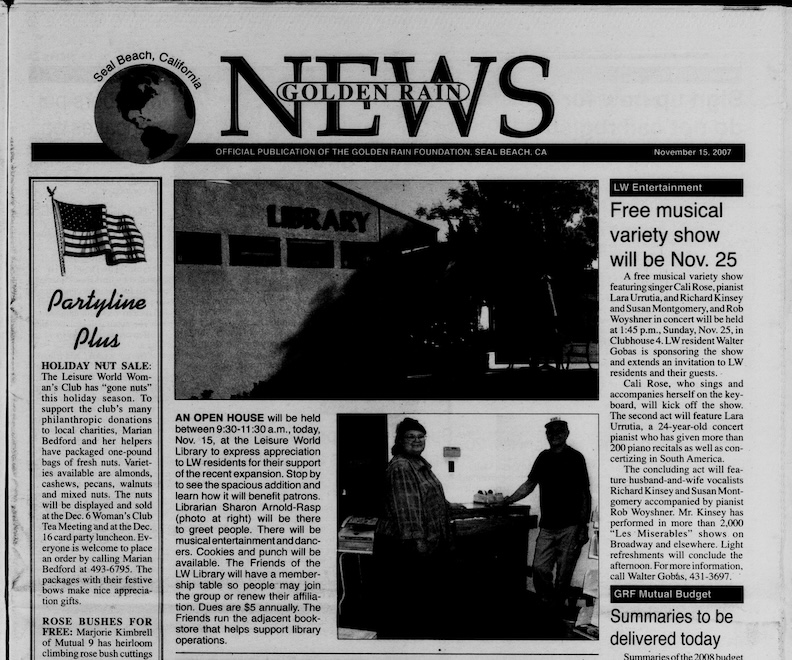 Newspaper, photo of Library at Open House after remodel.
